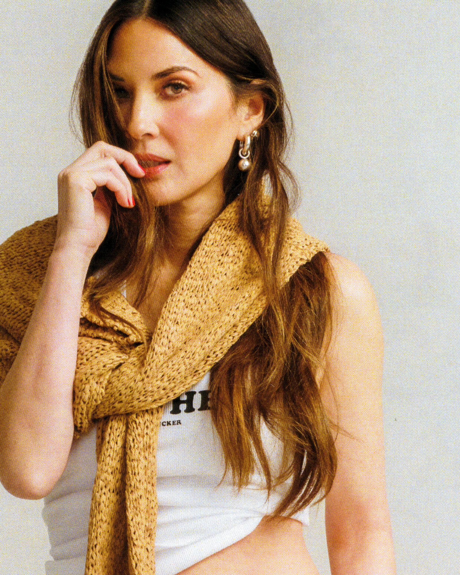 Image may contain Olivia Munn Adult Person Clothing Scarf Face Head Photography and Portrait