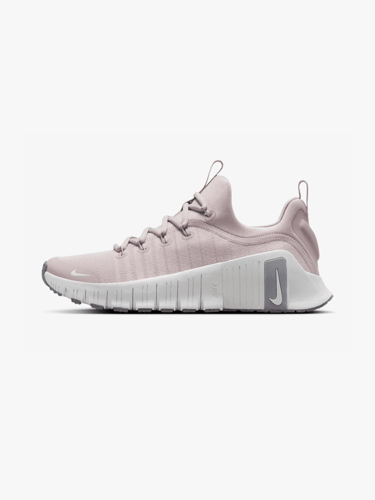 Free Metcon 6 in branded soft pink gray and white color way on light gray background