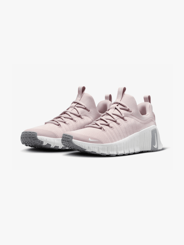 Free Metcon 6 in branded soft pink gray and white color way on light gray background