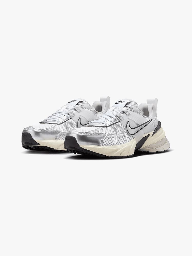 V2K Run sneakers in silver black and white color way on light gray background